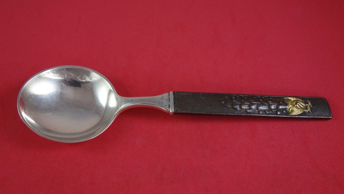 Tiffany & Co Kozuka Spoon Sterling Silver Bronze Gilt Peacock 7 1/4": Tiffany & Co Kozuka Spoon Sterling Silver Bronze Gilt Peacock 7 1/4" This exquisite gumbo soup spoon features a stunning design in the Kozuka pattern by Tiffany & Co. The spoon boasts a bronze gilt ha