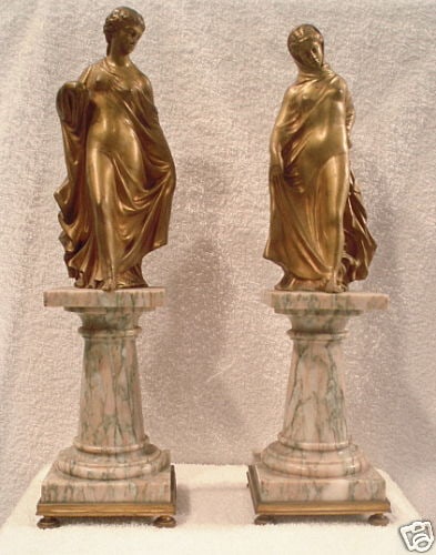 Original 19th Century French Bronze Statues on Marble Bases: Original 19th Century French Bronze Statues on Marble Bases Presenting a magnificent pair of original 19th-century French dore bronze statues depicting two semi-nude ladies, beautifully situated on ma