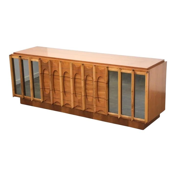 Mid Century Modern Walnut Tobago Brutalist Dresser with Mirror Details: Mid Century Modern Walnut Tobago Brutalist Dresser with Mirror Details This mid-century modern walnut Tobago long dresser combines sleek design with functional elegance. Featuring mirrored details and