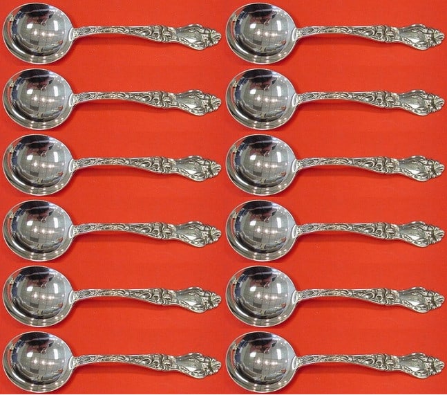 Frank Whiting Lily Sterling Silver Cream Soup Spoon Set of 12: Frank Whiting Lily Sterling Silver Cream Soup Spoon Set of 12 This exquisite set of 12 cream soup spoons features the elegant Lily pattern by Frank Whiting. Crafted from high-quality sterling silver,