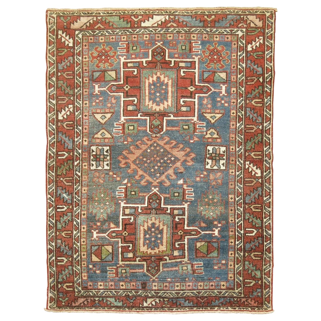 Zabihi Collection Hand-Knotted Antique Persian Heriz Rug 40 x 51 in: Zabihi Collection Hand-Knotted Antique Persian Heriz Rug 40 x 51 in This exquisite Antique Persian Heriz rug from the Zabihi Collection features a soft denim blue field complemented by rustic hues, em