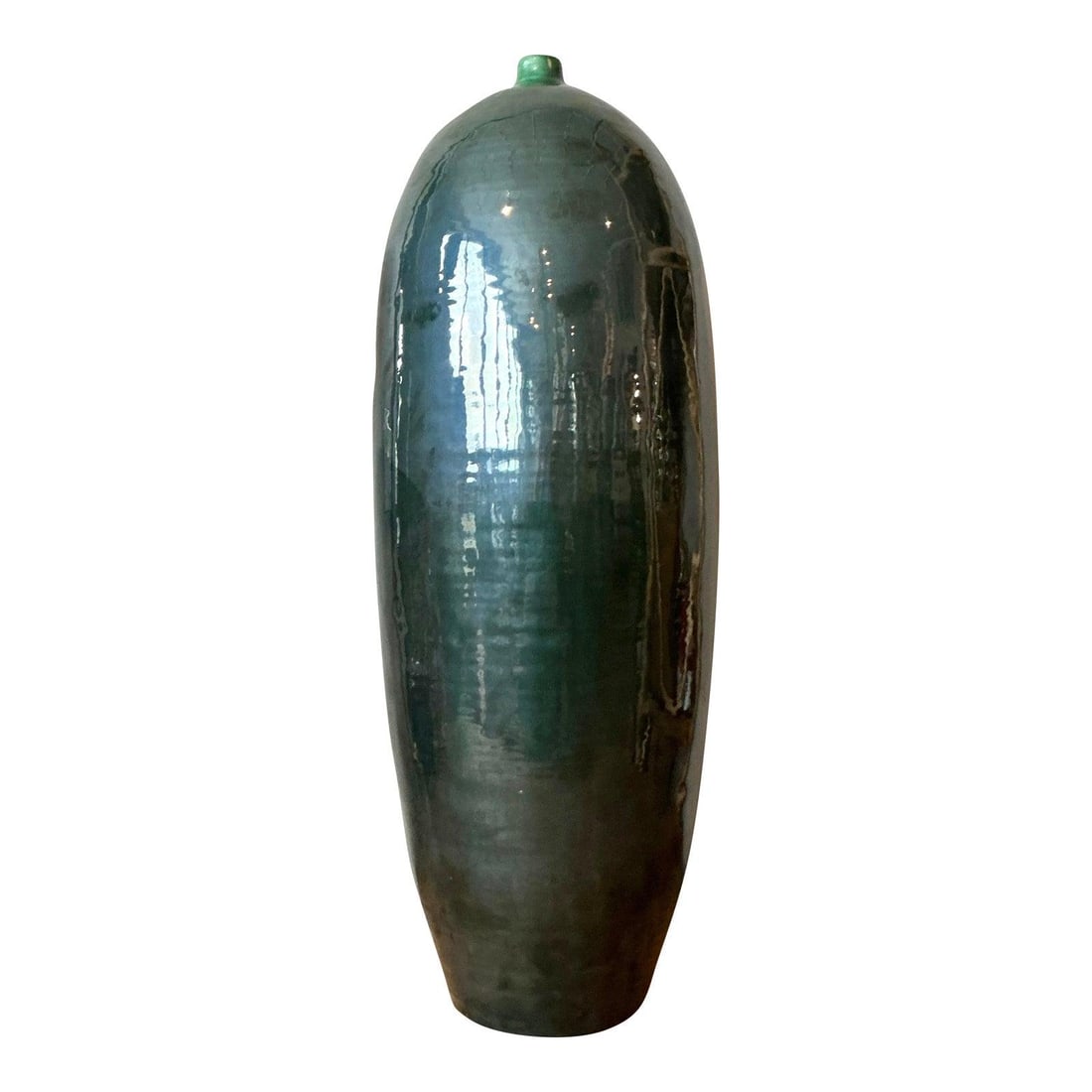 Monumental Mid-Century Glazed Ceramic Floor Vase in Emerald Green: Monumental Mid-Century Glazed Ceramic Floor Vase in Emerald Green This monumental vintage ceramic floor vase showcases a sleek, elongated torpedo silhouette that tapers into a narrow bottle neck. The