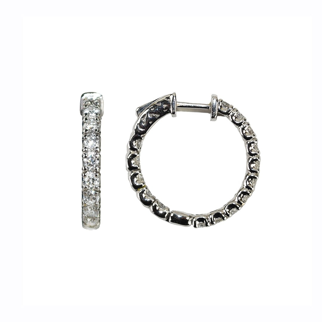 Pair of 18k White Gold Diamond Hoop Earrings 3.00 Carats SI Clarity H-I Color: Pair of 18k White Gold Diamond Hoop Earrings 3.00 Carats SI Clarity H-I Color These pre-owned hoop earrings feature 18k white gold and round brilliant cut diamonds totaling 3.00 carats. The diamonds h