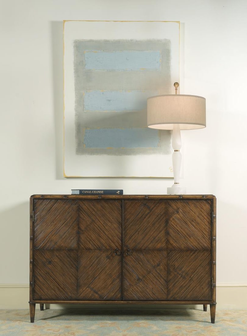 Port Eliot Island Regency Crushed Bamboo Cabinet Knotty Pecan Finish: Port Eliot Island Regency Crushed Bamboo Cabinet Knotty Pecan Finish Introducing the Island Regency Crushed Bamboo Cabinet, a stunning addition to your home that combines style and functionality. This