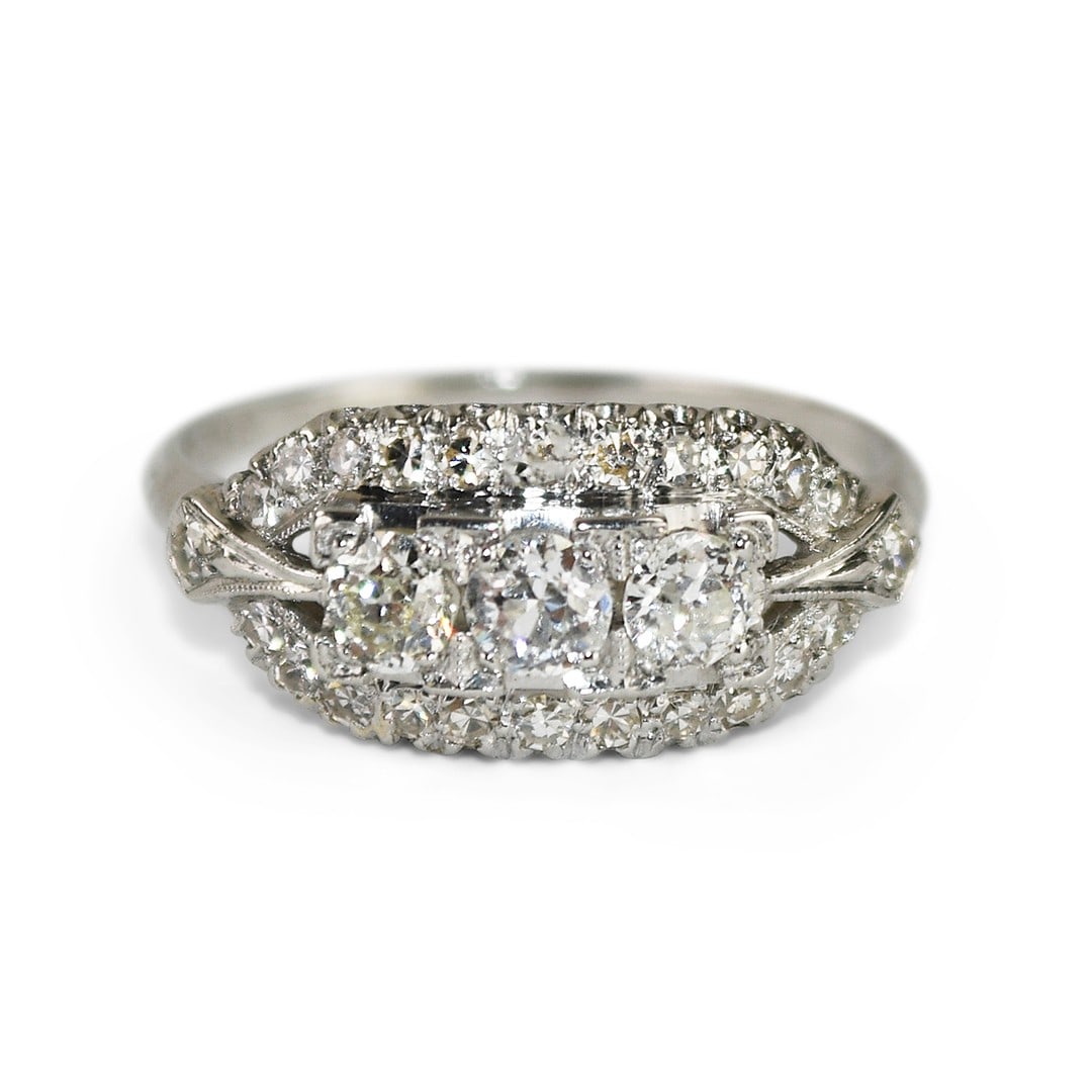 Art Deco Platinum Ring with 0.75ct Old European Cut Diamonds: Art Deco Platinum Ring with 0.75ct Old European Cut Diamonds This ladies' Art Deco ring features a platinum and iridium setting adorned with three old European cut diamonds at the top, totaling 0.50 c