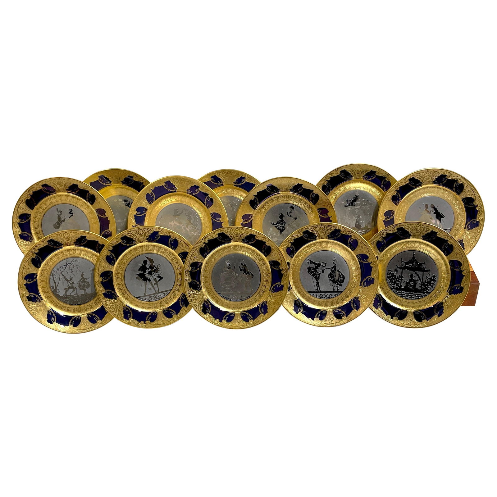 Set of 12 Limoges Gold and Platinum Encrusted Service Plates: Set of 12 Limoges Gold and Platinum Encrusted Service Plates Discover the elegance of this magnificent set of 12 Limoges service plates, featuring exquisite gold and platinum encrustations. Crafted