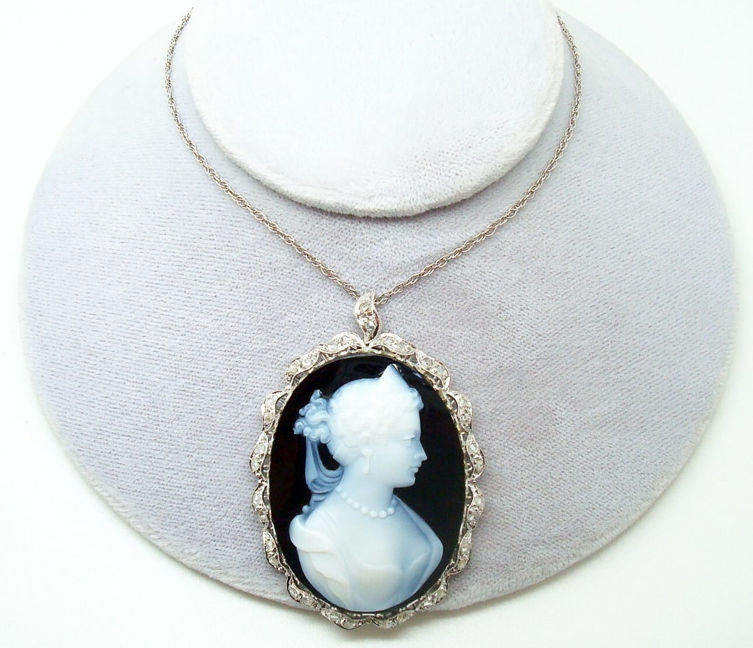 18k White Gold Vintage Agate Cameo Diamond Pendant GIA Certified: 18k White Gold Vintage Agate Cameo Diamond Pendant GIA Certified This exquisite vintage pendant showcases a stunning large oval black and white banded agate stone cameo, measuring approximately 40mm x