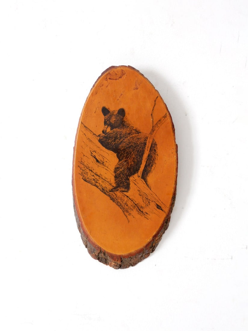 Barry Nehr Vintage Bear Cub Wood Slice Wall Art 12x6: Barry Nehr Vintage Bear Cub Wood Slice Wall Art 12x6 This vintage wood slice wall hanging showcases a beautifully detailed illustration by Barry Nehr of a black bear cub climbing a tree, meticulously
