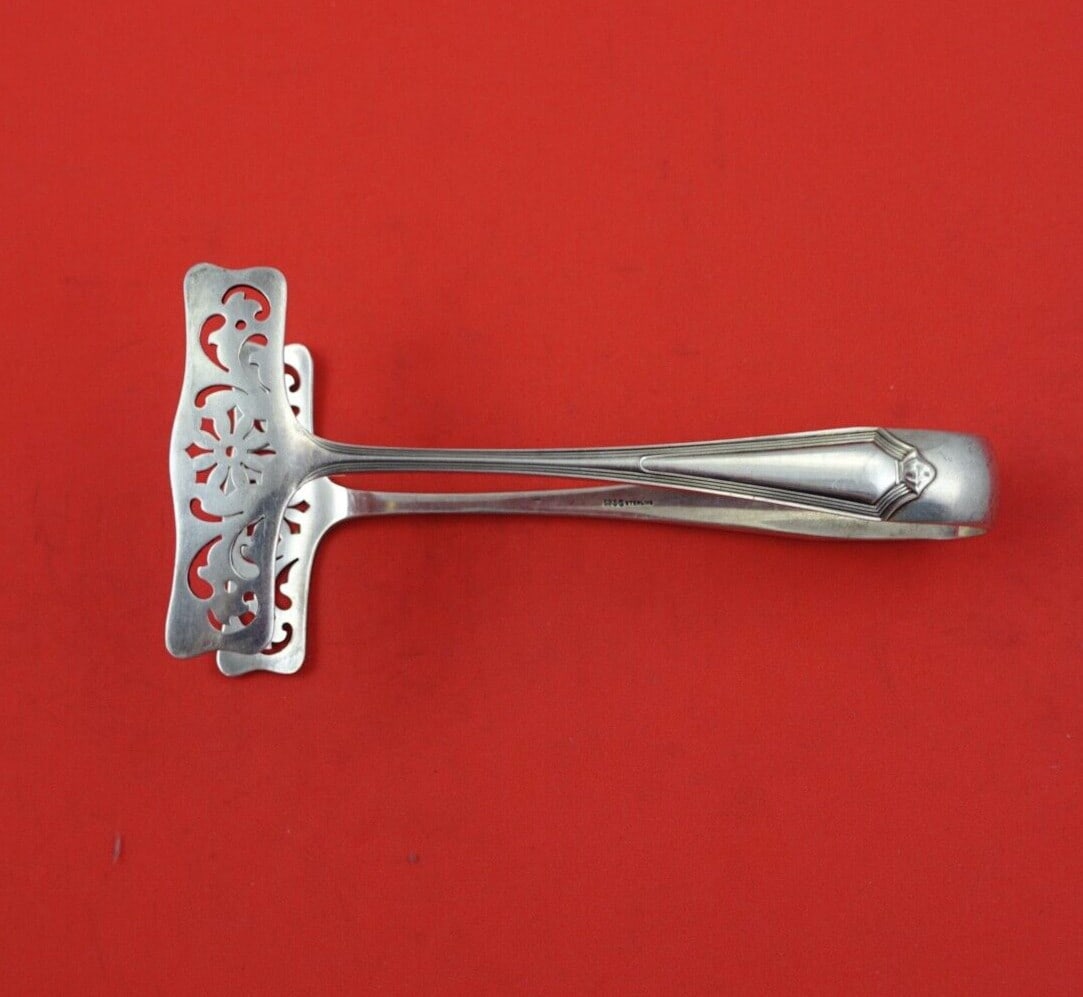 Gorham Plymouth Sterling Silver Toast Tong 5 Inch Serving Piece: Gorham Plymouth Sterling Silver Toast Tong 5 Inch Serving Piece Presenting the Plymouth Toast Tong by Gorham, a beautifully crafted serving piece made from high-quality sterling silver. This pierced t