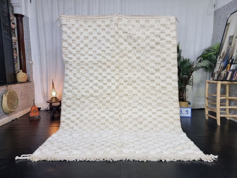 Handmade Moroccan Berber Wool Area Rug 9.84 x 6.56 Feet: Handmade Moroccan Berber Wool Area Rug 9.84 x 6.56 Feet Transform your space with this exquisite Soft White Engraved Handmade Moroccan Berber Wool Area Rug. Meticulously handwoven by skilled Berber wo