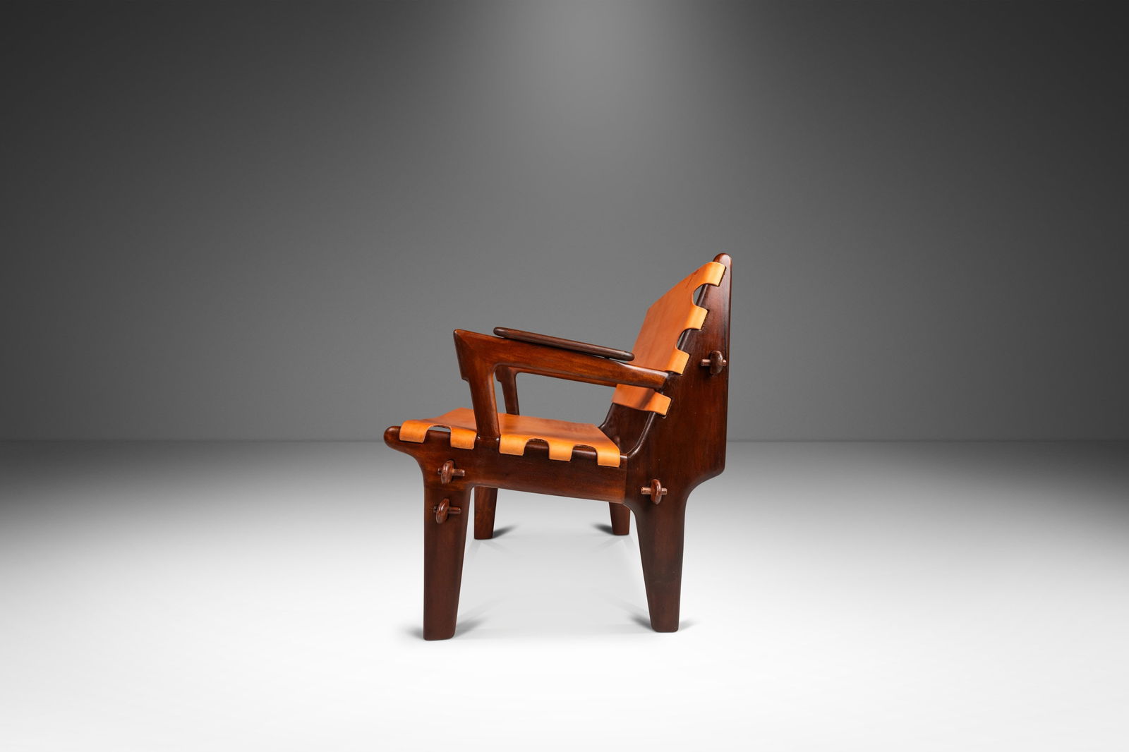 Restored Mid-Century Modern Leather Sling Chair by Angel Pazmino: Restored Mid-Century Modern Leather Sling Chair by Angel Pazmino Experience the elegance of Mid-Century Modern design with this rare sling chair by renowned Ecuadorian furniture maker Angel Pazmino, c