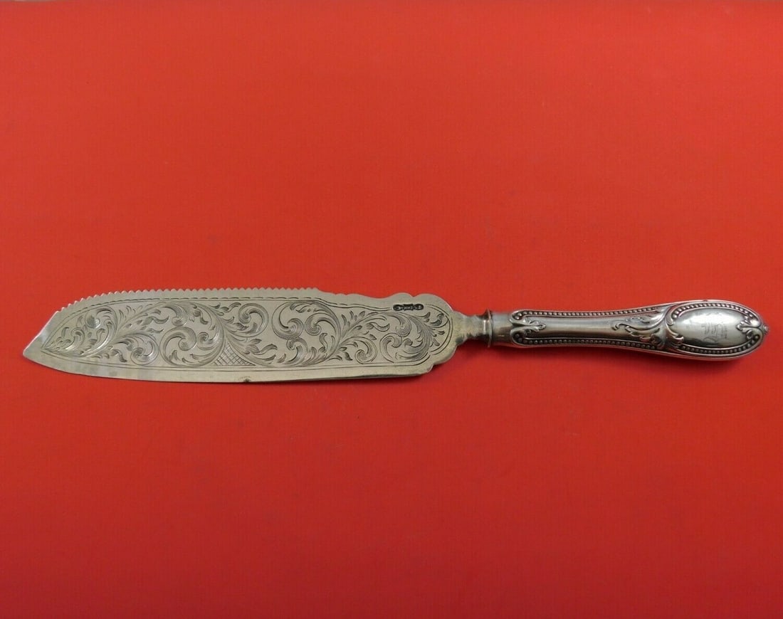 Whiting Sterling Silver Cake Saw Bright-Cut Monogrammed 11.5 Inch: Whiting Sterling Silver Cake Saw Bright-Cut Monogrammed 11.5 Inch This exquisite cake saw by Whiting features a bright-cut design and is crafted from high-quality sterling silver. The hollow handle of