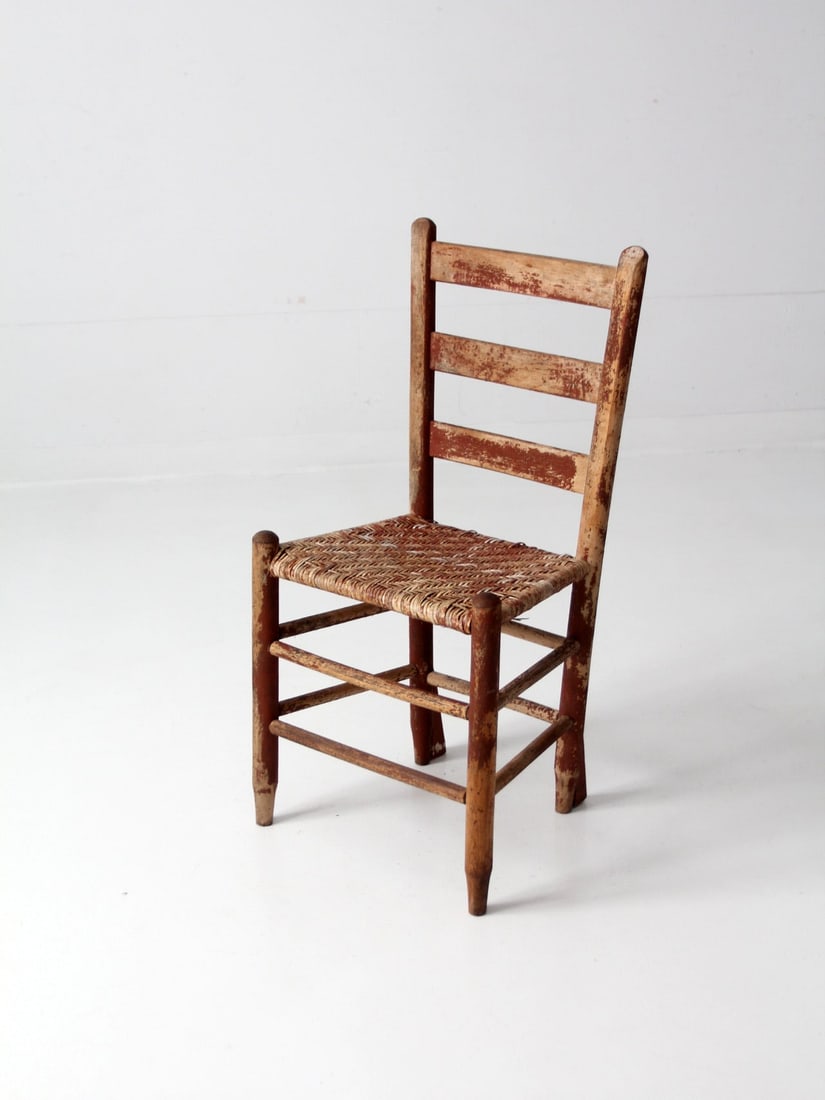 Antique Primitive Accent Chair with Herringbone Cane Seat: Antique Primitive Accent Chair with Herringbone Cane Seat This antique primitive accent chair showcases a distinctive herringbone woven cane seat, beautifully complemented by aged brick red paint. The