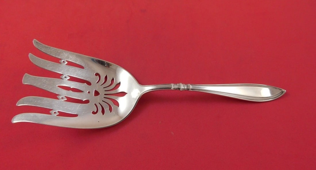 Gorham Portsmouth Sterling Silver Asparagus Fork 9 1/8": Gorham Portsmouth Sterling Silver Asparagus Fork 9 1/8" Discover the elegance of the Portsmouth pattern serving fork by Gorham, crafted from high-quality sterling silver. This asparagus fork measures