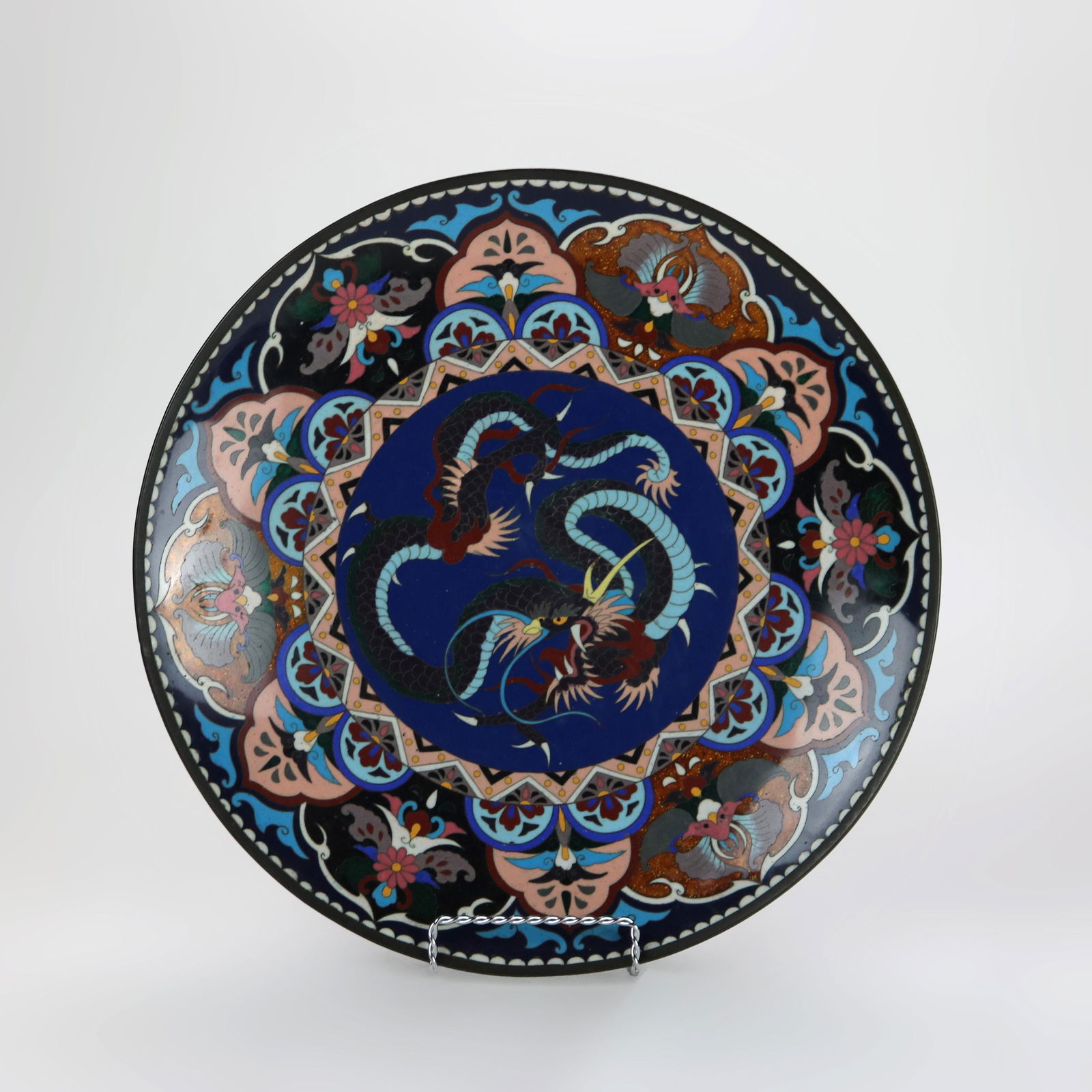 Antique Japanese Cloisonne Charger Dragon Floral Design c1920: Antique Japanese Cloisonne Charger Dragon Floral Design c1920 This antique Japanese cloisonne charger, dating to circa 1920, features an intricate design showcasing a vibrant dragon surrounded by deta