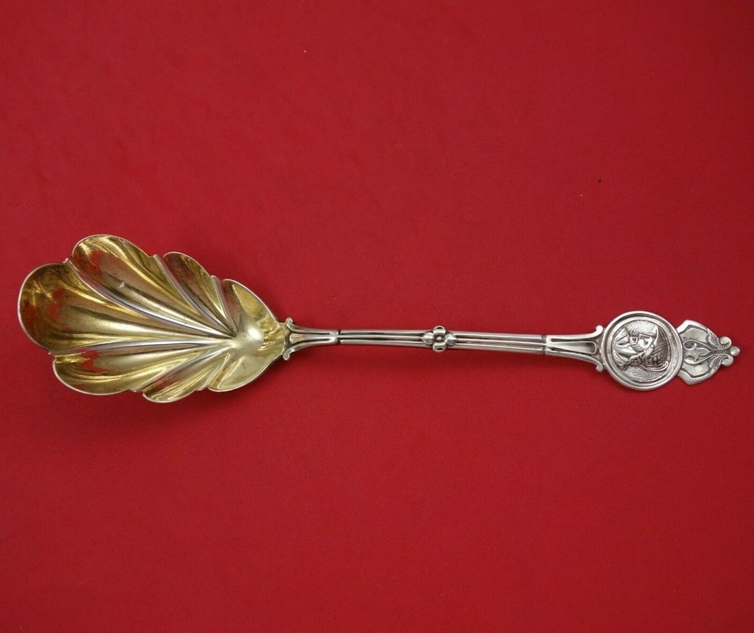 Koehler and Ritter Medallion Sterling Silver Berry Spoon Gold Wash 9.5": Koehler and Ritter Medallion Sterling Silver Berry Spoon Gold Wash 9.5" This exquisite Medallion pattern serving spoon by Koehler and Ritter features a beautiful gold wash finish. Crafted from high-qu