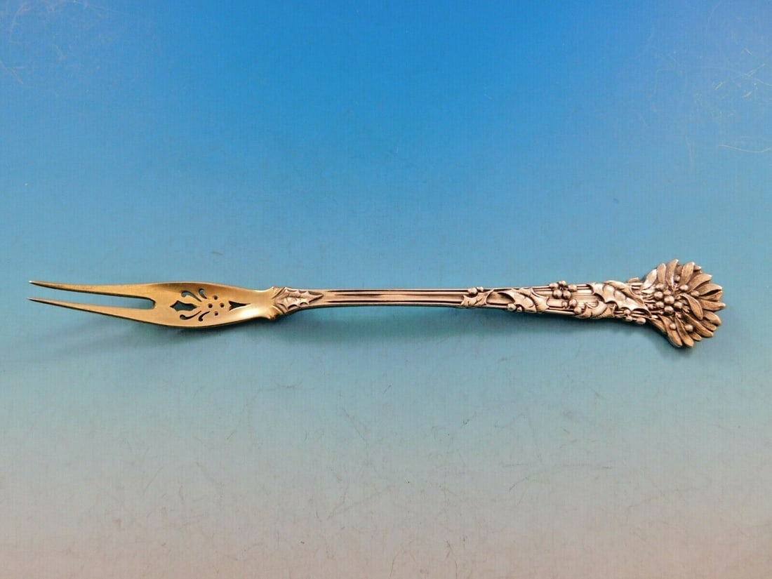 Tiffany & Co. Holly Sterling Silver Olive Fork 7 with 10 Piercings: Tiffany & Co. Holly Sterling Silver Olive Fork 7 with 10 Piercings This exquisite serving fork, crafted by Tiffany & Co. in the iconic Holly pattern, showcases a stunning design that features intricat