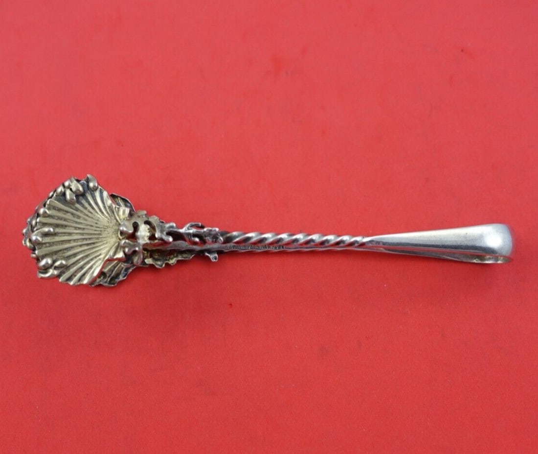 Shiebler Sterling Silver Oyster Tong Gold Wash Shells Seaweed 5.5" Circa 1890: Shiebler Sterling Silver Oyster Tong Gold Wash Shells Seaweed 5.5" Circa 1890 This exquisite Shiebler sterling silver oyster tong, crafted circa 1890, features a stunning gold wash finish adorned with