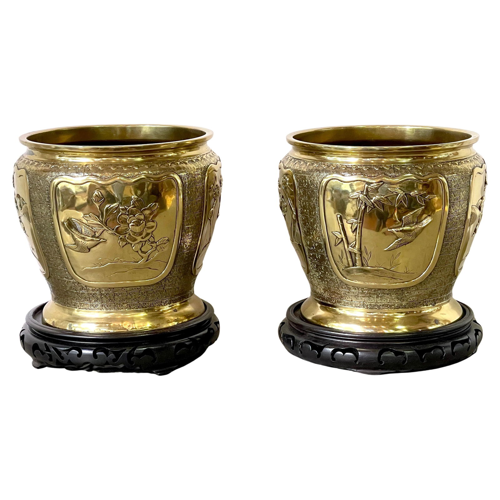 Antique Chinese Brass Planters with Carved Wood Stands Set of 2: Antique Chinese Brass Planters with Carved Wood Stands Set of 2 This exquisite pair of Chinese brass floral and bird planters, crafted circa 1900s, exemplifies superb craftsmanship and timeless elegan