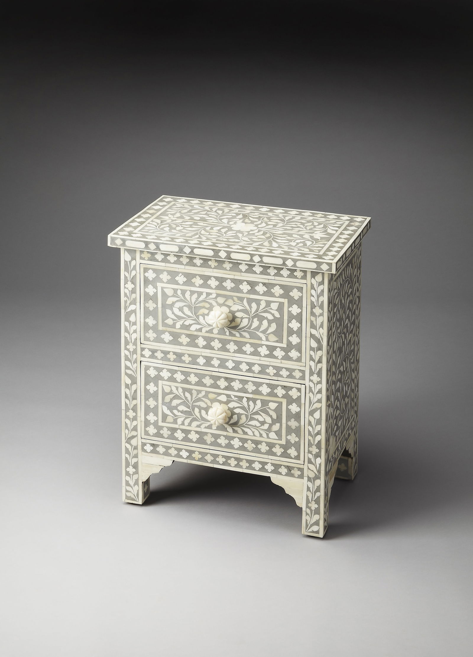 Butler Accent Chest with Unique Bone Inlay Indian Style: Butler Accent Chest with Unique Bone Inlay Indian Style This elegant accent chest showcases a unique bone inlay design, adding a touch of sophistication to any space. Crafted from a combination of man