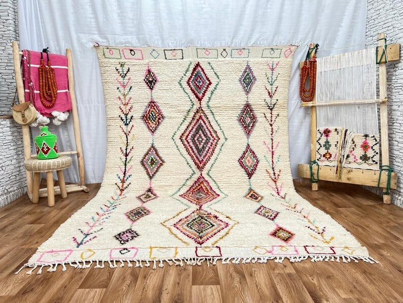 Handwoven Moroccan Rug 8 x 5 Feet 100% Sheep Wool: Handwoven Moroccan Rug 8 x 5 Feet 100% Sheep Wool Experience the timeless beauty of this elegant authentic rug, handwoven in the Atlas Mountains by skilled local Berber women weavers. Crafted using tr