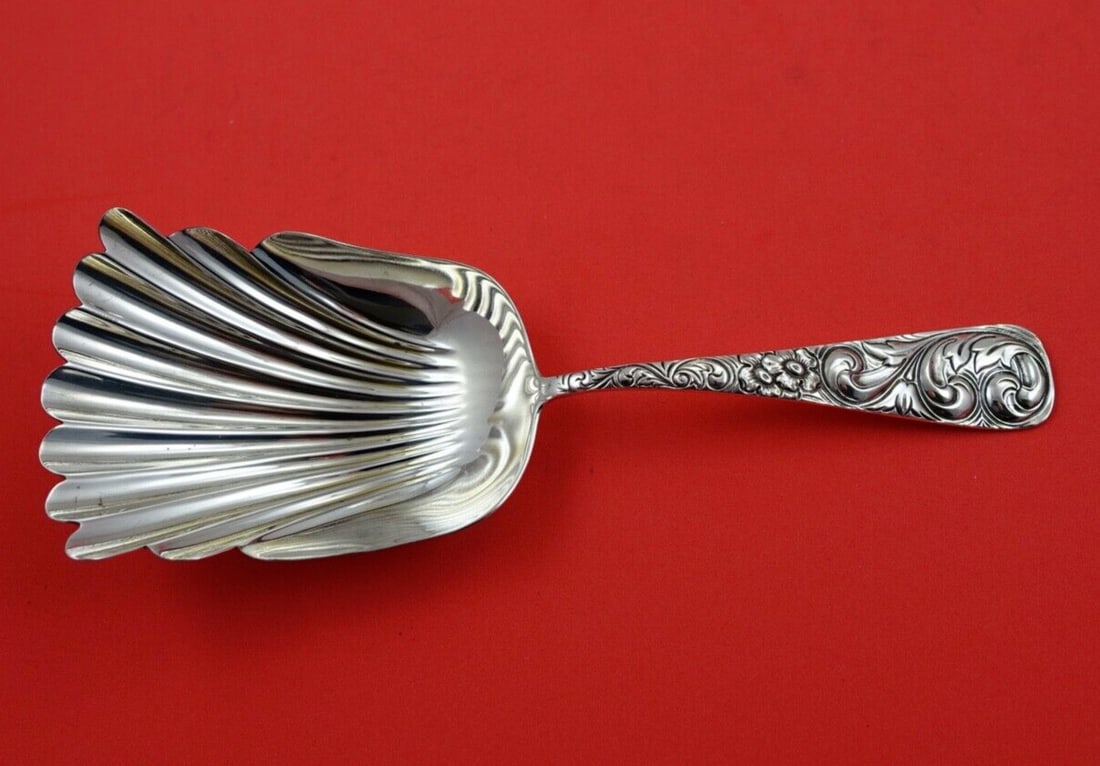 Durgin Scroll Sterling Silver Cracker Scoop 7 3/4" Serving Piece: Durgin Scroll Sterling Silver Cracker Scoop 7 3/4" Serving Piece This exquisite 7 3/4" cracker scoop is crafted from high-quality sterling silver and features the elegant Scroll pattern by Durgin. The