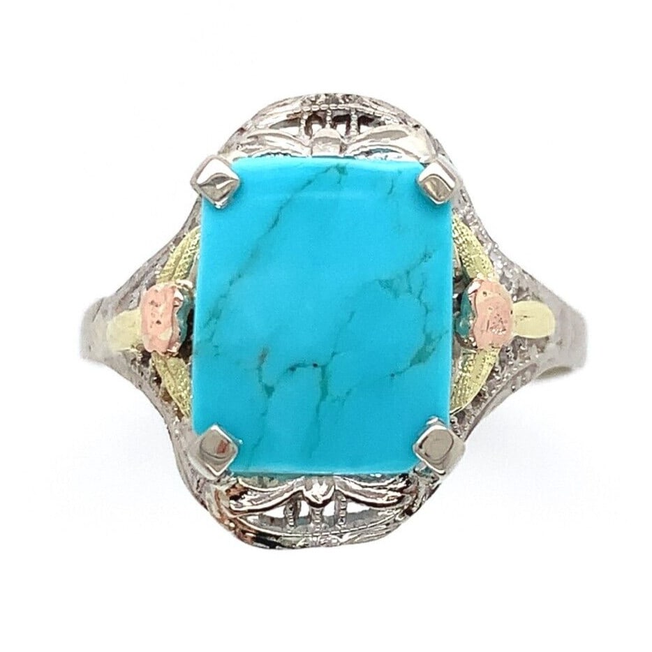 Vintage 10k Gold Turquoise Ring with Rose and Green Gold Flowers: Vintage 10k Gold Turquoise Ring with Rose and Green Gold Flowers This stunning vintage ring features a genuine natural turquoise stone, elegantly set in a multi-tone gold band. The main stone, a light