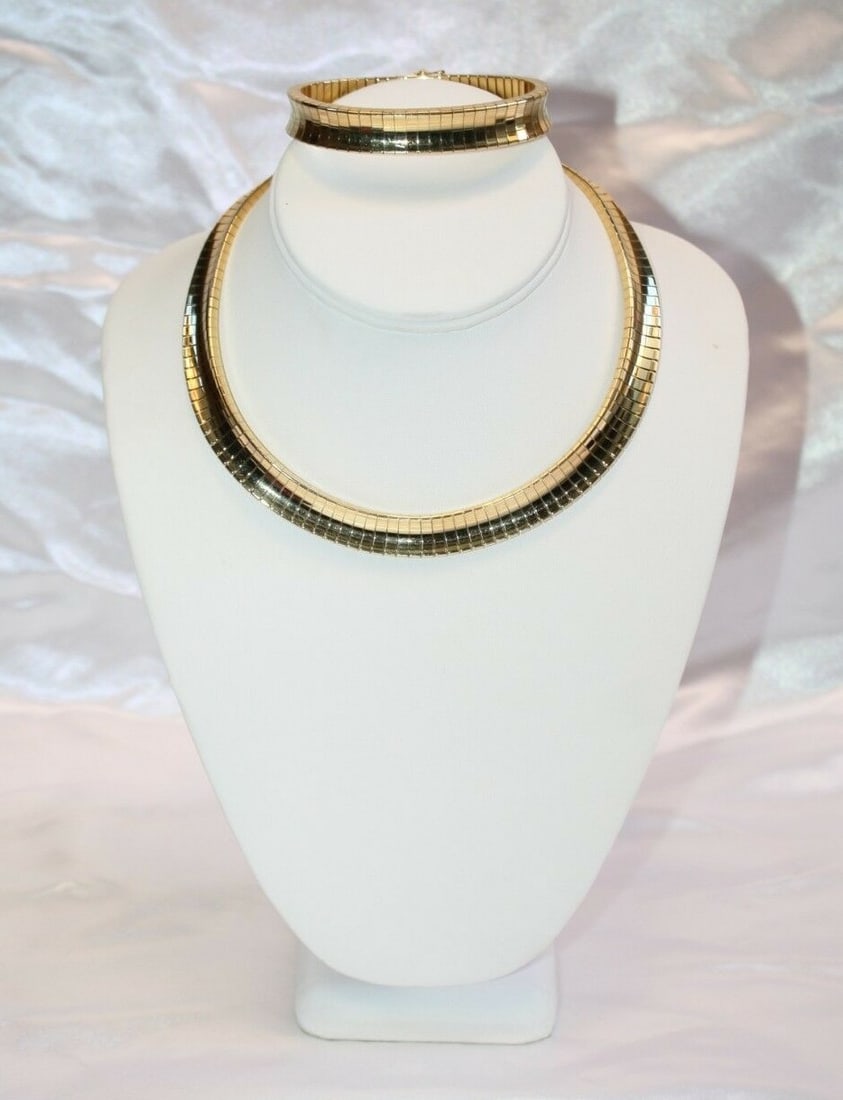 1960s French 18K Gold Cleopatra Necklace Bracelet Set: 1960s French 18K Gold Cleopatra Necklace Bracelet Set Discover the elegance of this stunning 1960's French 18K gold Cleopatra chic necklace and bracelet set. Crafted with meticulous attention to detai