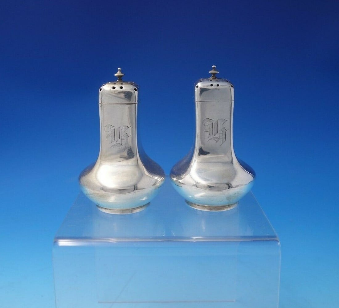 Dominick and Haff Eastlake Sterling Silver Salt and Pepper Shaker Set: Dominick and Haff Eastlake Sterling Silver Salt and Pepper Shaker Set This exquisite Eastlake sterling silver salt and pepper shaker set is crafted by Dominick and Haff, showcasing a stunning design c