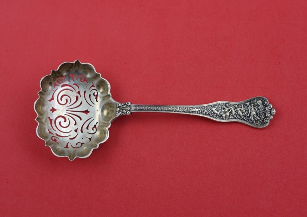 Tiffany & Co Olympian Sterling Silver Sugar Sifter Oval Swirl 6.25": Tiffany & Co Olympian Sterling Silver Sugar Sifter Oval Swirl 6.25" This exquisite sugar sifter from Tiffany & Co. features the renowned Olympian pattern, first introduced in 1878. Crafted from high-q