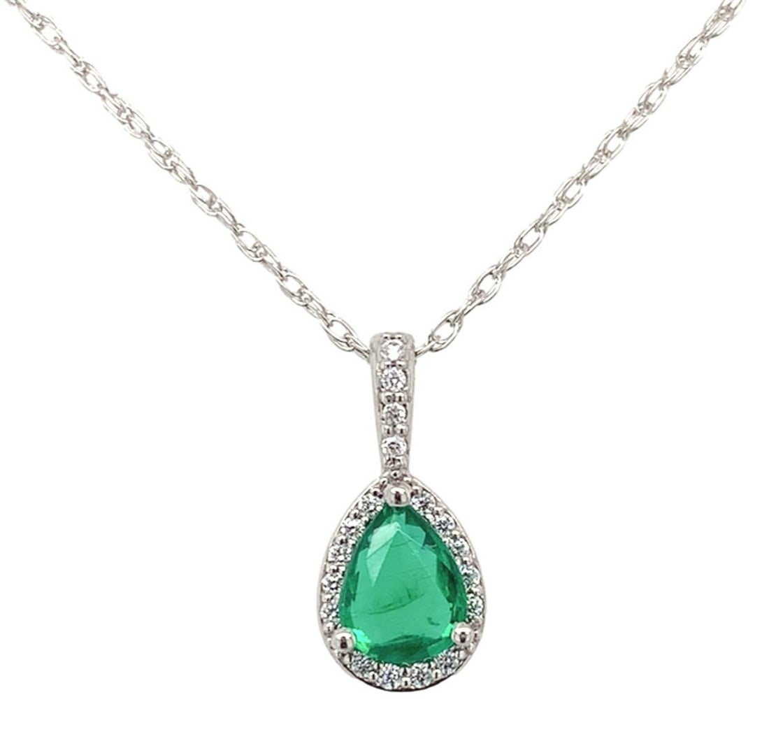 Platinum .46ct Pear Emerald Diamond Halo Necklace Authentic GIA: Platinum .46ct Pear Emerald Diamond Halo Necklace Authentic GIA This stunning pendant features a genuine, earth-mined pear-shaped emerald, weighing 0.46 carats, beautifully complemented by a halo of 1