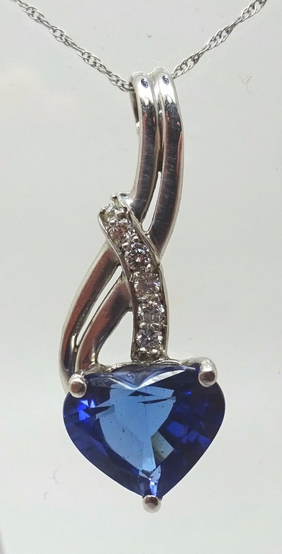 14k White Gold 3.10ct Natural Tanzanite Heart Pendant with 6 Diamonds: 14k White Gold 3.10ct Natural Tanzanite Heart Pendant with 6 Diamonds This stunning pendant showcases a radiant 14k white gold design featuring a 3.10ct genuine natural tanzanite in a heart shape, com