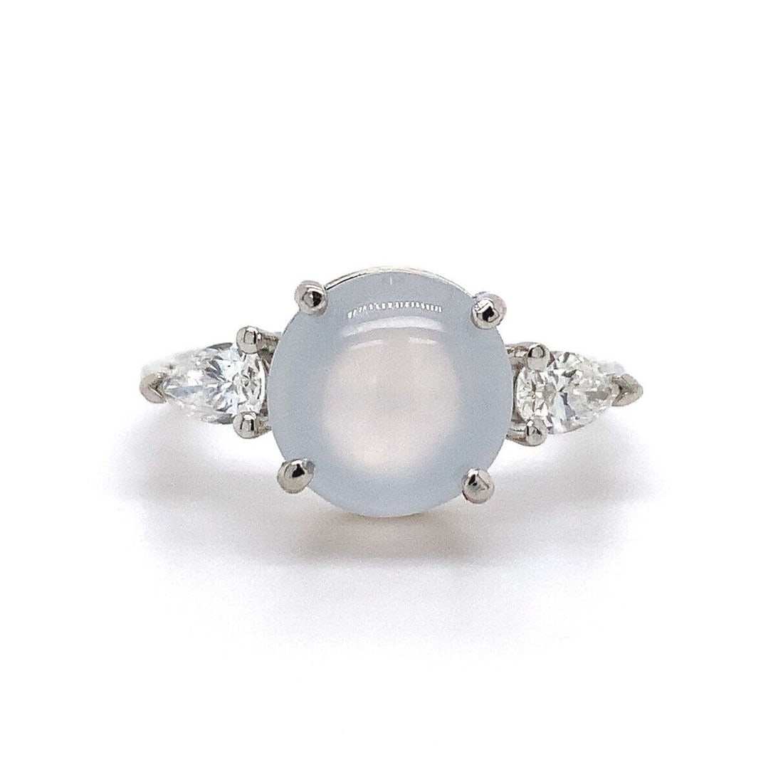 Platinum 3.21ct Ice Jadeite Jade and Diamond Ring GIA Certified: Platinum 3.21ct Ice Jadeite Jade and Diamond Ring GIA Certified This exquisite platinum ring showcases a stunning 3.21ct ice jadeite jade as its centerpiece, complemented by two sparkling pear-shaped