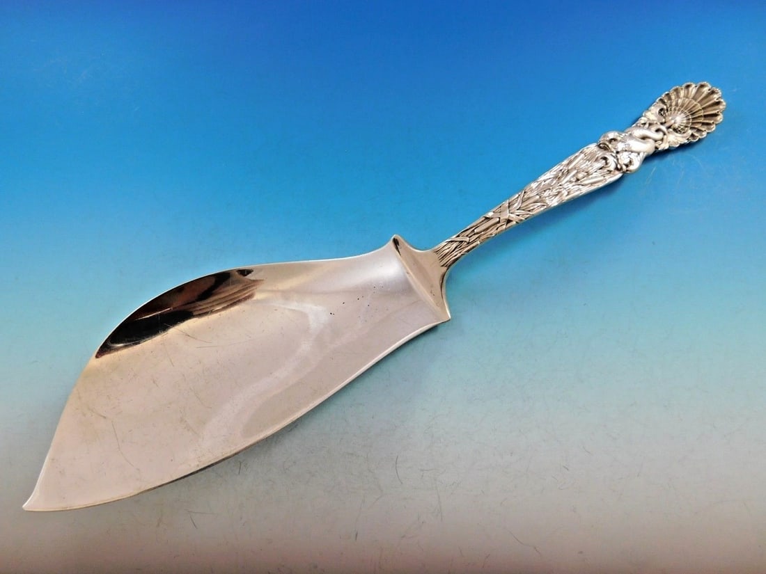 Rare Tiffany & Co Dolphin Sterling Silver Fish Server 12.5": Rare Tiffany & Co Dolphin Sterling Silver Fish Server 12.5" This exquisite fish server from Tiffany & Co. is a rare find, masterfully crafted in sterling silver with a stunning dolphin motif. Measurin