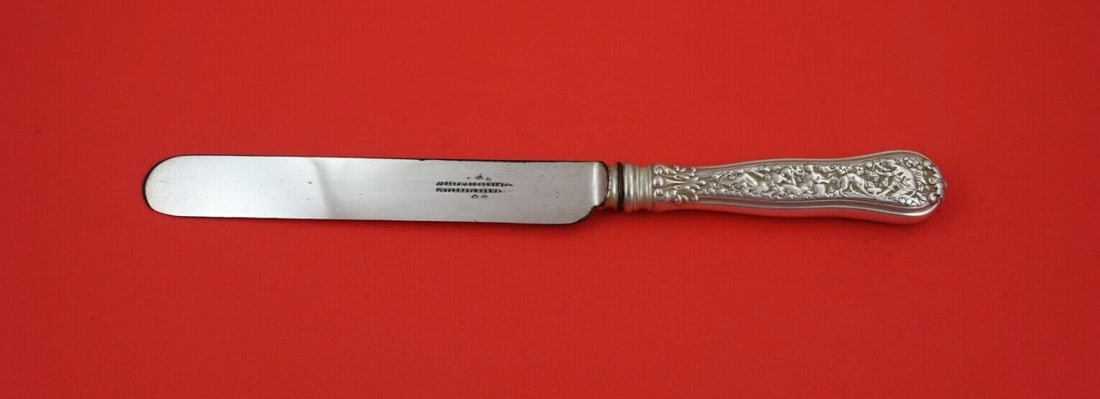 Tiffany & Co Olympian Sterling Silver Banquet Knife 10 1/4": Tiffany & Co Olympian Sterling Silver Banquet Knife 10 1/4" This exquisite banquet knife from the Olympian pattern by Tiffany & Co. features a sterling silver hollow handle complemented by a blunt sil