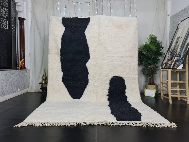 Handmade Moroccan Berber Wool Rug White Black 9.84 x 6.56 Feet: Handmade Moroccan Berber Wool Rug White Black 9.84 x 6.56 Feet Experience the charm of Moroccan craftsmanship with this beautiful handmade white and black Berber wool rug. Expertly handwoven by local