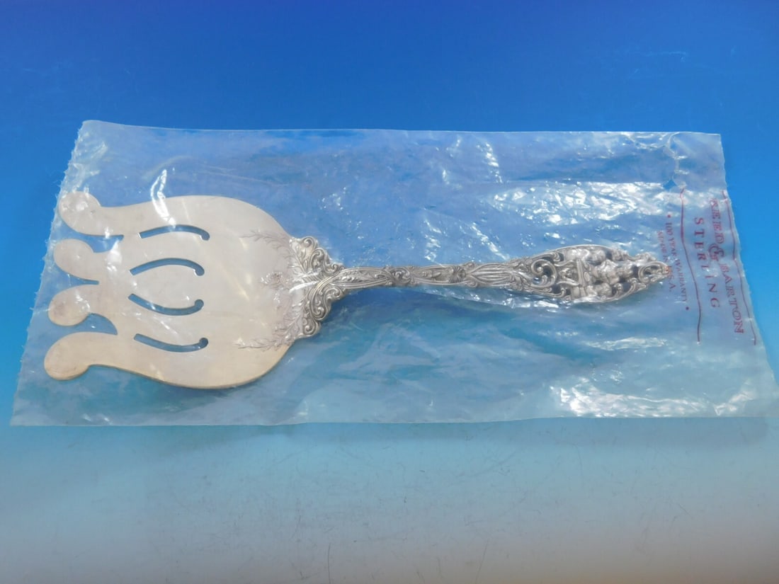 Dominick & Haff Labors of Cupid Sterling Silver Asparagus Fork 9 3/4": Dominick & Haff Labors of Cupid Sterling Silver Asparagus Fork 9 3/4" This exquisite asparagus fork features the elegant Labors of Cupid pattern by Dominick & Haff. Crafted from high-quality sterling