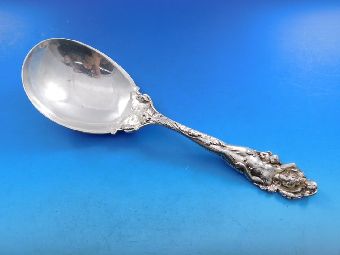 Reed and Barton Love Disarmed Sterling Silver Serving Spoon 10 3/4 Inch: Reed and Barton Love Disarmed Sterling Silver Serving Spoon 10 3/4 Inch This exquisite serving spoon from Reed and Barton features the beautiful "Love Disarmed" pattern, showcasing the elegant Art Nou