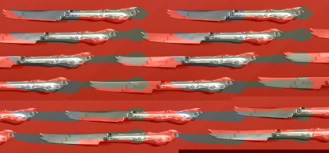 Joan of Arc International Sterling Silver Steak Knife Set 12 pc 8.5 in: Joan of Arc International Sterling Silver Steak Knife Set 12 pc 8.5 in This exquisite 12-piece steak knife set features the Joan of Arc pattern by International Sterling Silver, showcasing a harmoniou