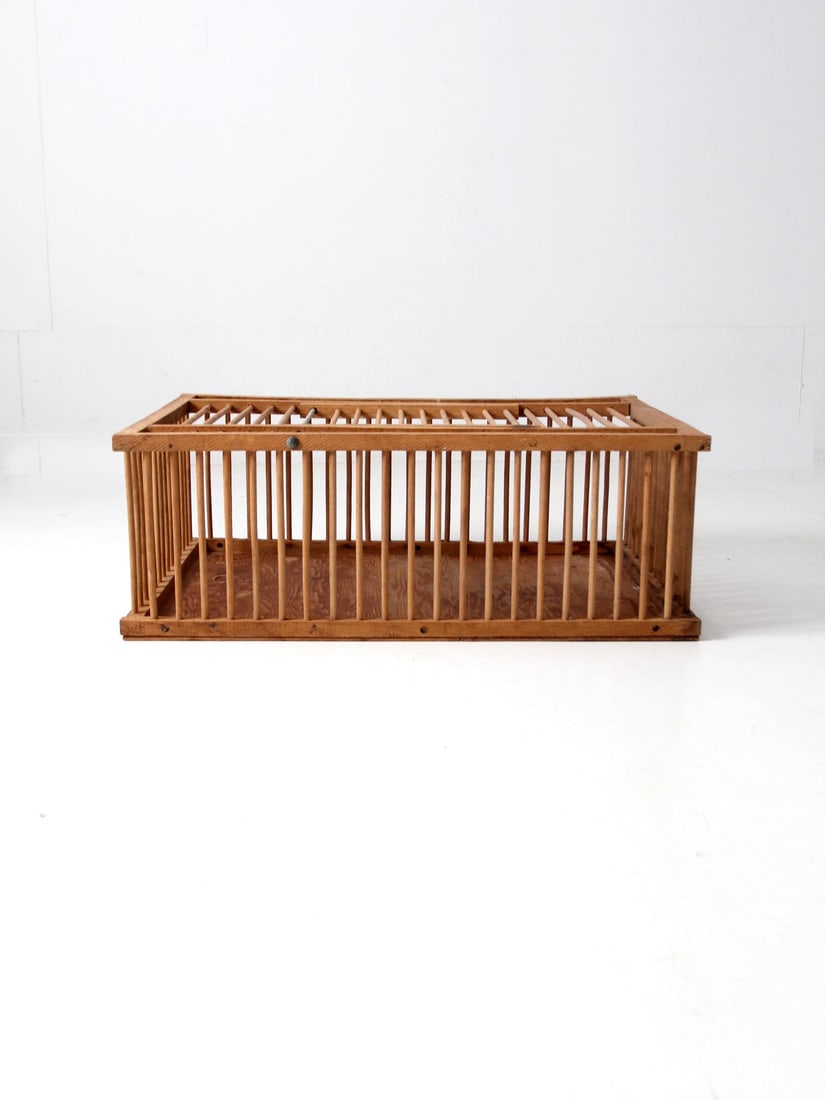 Vintage Mid Century Wooden Farm Crate with Hinged Lid: Vintage Mid Century Wooden Farm Crate with Hinged Lid Discover a charming vintage wooden farm crate from the mid 20th century. This unique piece features spindle bars and a sturdy solid wood base, sho