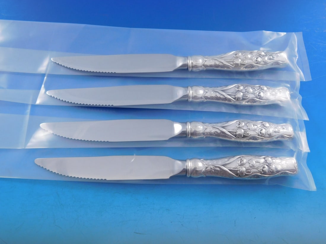 Whiting Lily of the Valley Sterling Silver Steak Knife Set 4pc: Whiting Lily of the Valley Sterling Silver Steak Knife Set 4pc This exquisite 4-piece steak knife set features the elegant Lily of the Valley pattern by Whiting. Crafted from high-quality sterling sil