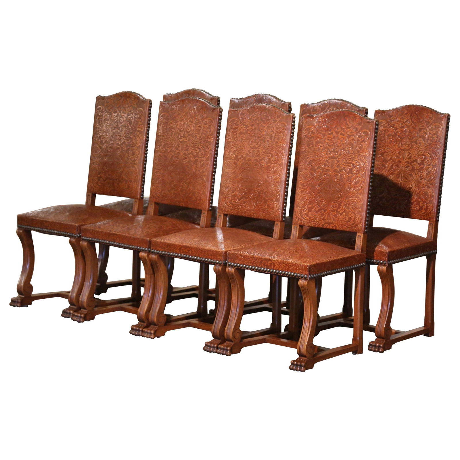 Set of 8 Early 20th Century Spanish Baroque Walnut Chairs with Leather Upholstery: Set of 8 Early 20th Century Spanish Baroque Walnut Chairs with Leather Upholstery This exquisite set of 8 Early 20th Century Spanish Baroque Chairs is a perfect addition to any dining or breakfast tab