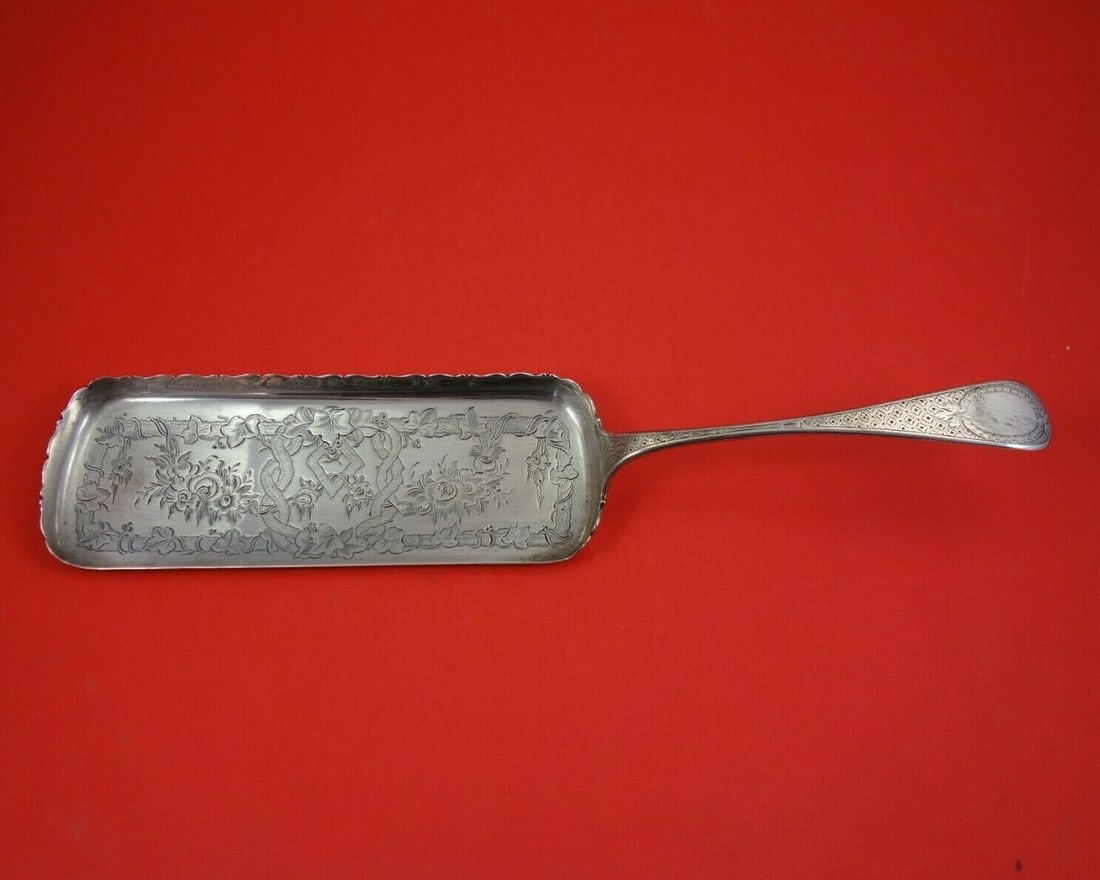 Tiffany & Co King William Sterling Silver Crumber 13 Bright-Cut Roses: Tiffany & Co King William Sterling Silver Crumber 13 Bright-Cut Roses This exquisite King William Crumber, crafted by Tiffany & Co., showcases a stunning bright-cut roses design. Measuring 13 inches,