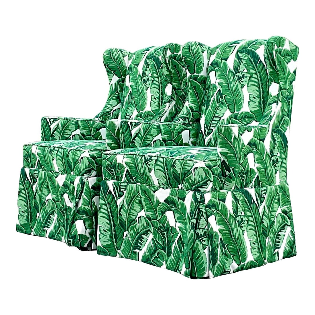 Pair of Coastal Wingback Chairs in Palm Frond Jacquard Upholstery: Pair of Coastal Wingback Chairs in Palm Frond Jacquard Upholstery This pair of vintage Coastal wingback chairs features a chic, modern silhouette complemented by a skirted base. Each chair is upholste
