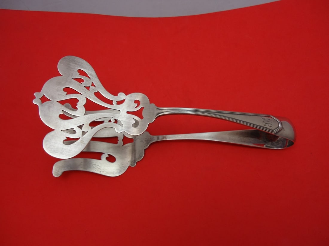 Dominick & Haff Queen Anne Plain Sterling Silver Asparagus Tongs 9 1/8": Dominick & Haff Queen Anne Plain Sterling Silver Asparagus Tongs 9 1/8" Introducing the Queen Anne Plain Asparagus Tongs by Dominick & Haff, a stunning addition to your serving pieces collection. Craf