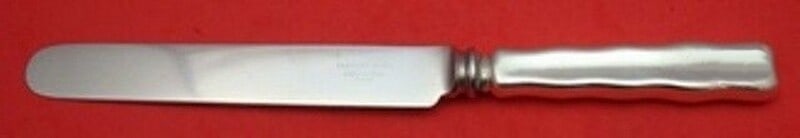 Tiffany & Co Lap Over Edge Plain Sterling Silver Dinner Knife 9 3/8": Tiffany & Co Lap Over Edge Plain Sterling Silver Dinner Knife 9 3/8" This exquisite dinner knife features the iconic Lap Over Edge Plain pattern by Tiffany & Co., crafted from high-quality sterling si