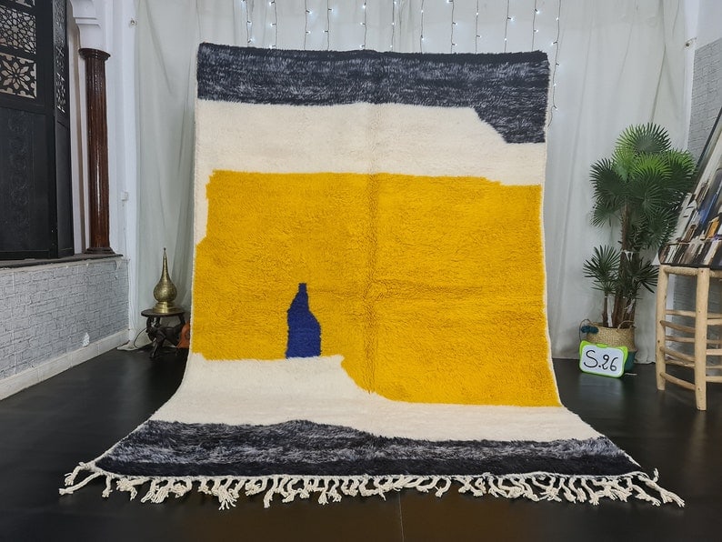 Authentic Moroccan Berber Wool Rug Handwoven in Atlas Mountains: Authentic Moroccan Berber Wool Rug Handwoven in Atlas Mountains Experience the elegance of this authentic handwoven Moroccan Berber wool rug. Crafted by skilled Berber women weavers in the Atlas Mount