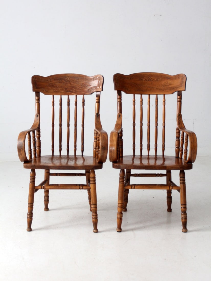 Vintage Yugoslavian Press-Back Armchairs Pair for Farmhouse Decor: Vintage Yugoslavian Press-Back Armchairs Pair for Farmhouse Decor This pair of mid-20th-century pressed-back armchairs showcases a classic design, featuring tall molded crest rails, turned spindles, a