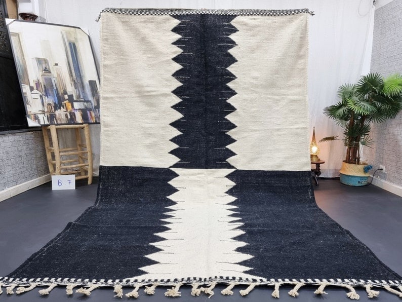 Authentic Handwoven Black and White Rug 10 x 5 Feet Morocco: Authentic Handwoven Black and White Rug 10 x 5 Feet Morocco Discover the charm of this authentic black and white rug, handwoven in the Atlas Mountains by skilled Berber women weavers. Crafted using tr