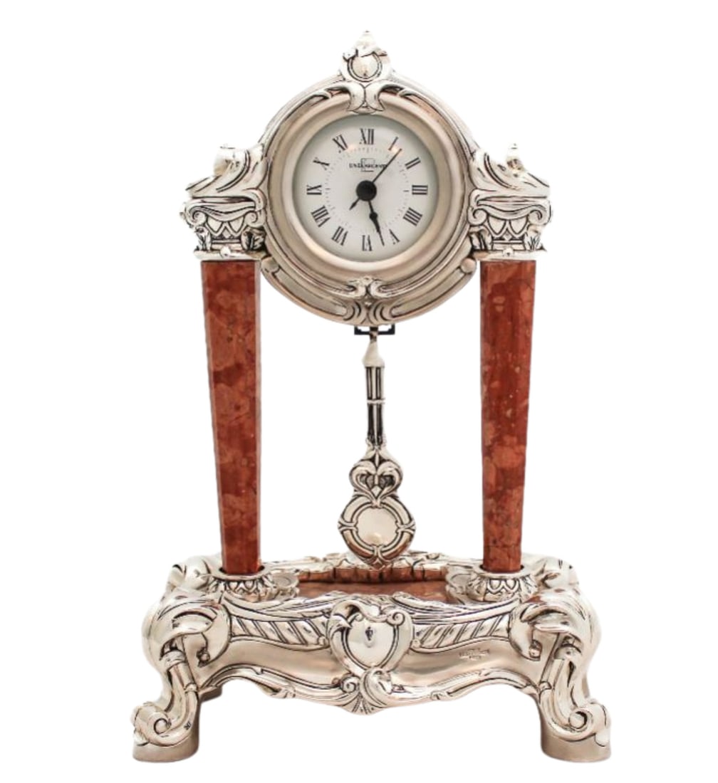 Italian Silver Plated Marble Column Table Clock with Pendulum: Italian Silver Plated Marble Column Table Clock with Pendulum This exquisite table clock showcases fine Italian craftsmanship with its stunning silver plated finish and elegant marble base. The clock